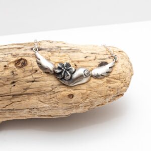 Breast and flower pendant